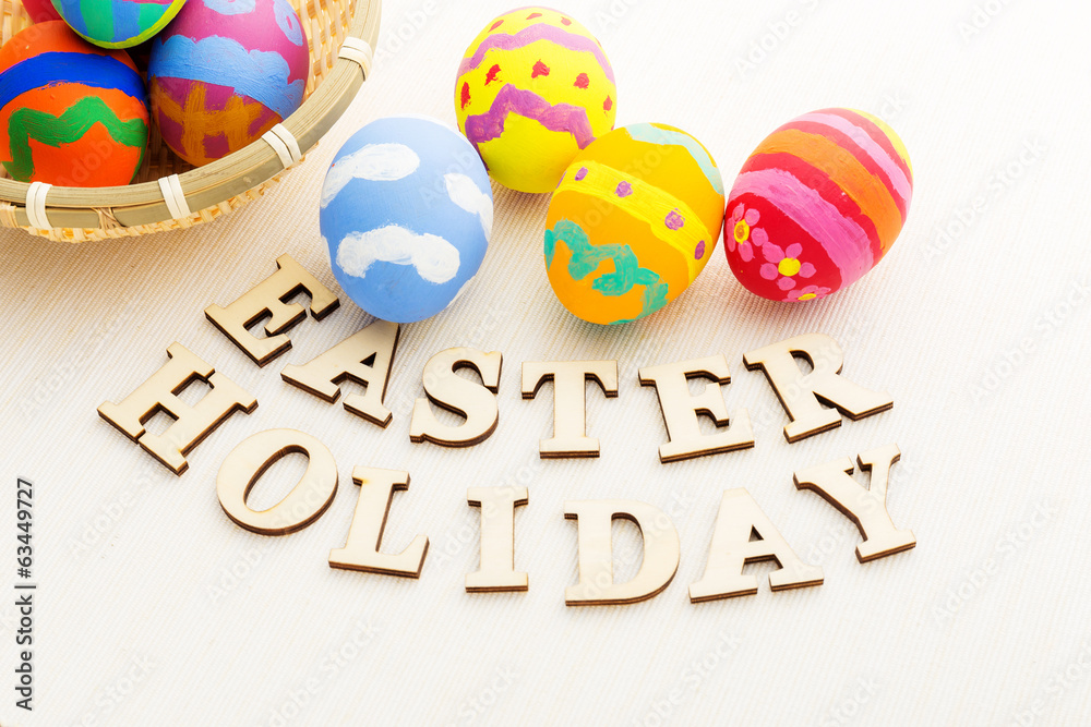 Colourful easter egg with wooden text Colourful easter egg with wooden text