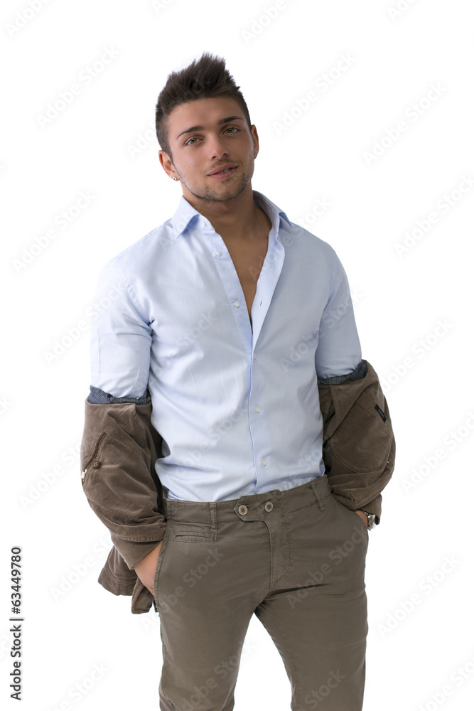 Handsome young man standing with jacket pulled down Handsome young man standing with jacket pulled down