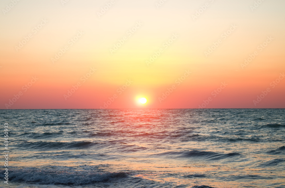 sea against the sunset sky.