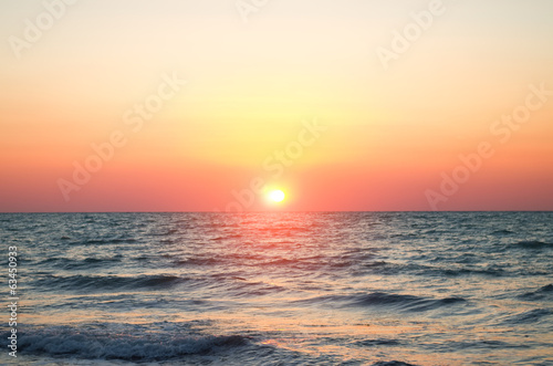 sea against the sunset sky. © Andrii Salivon