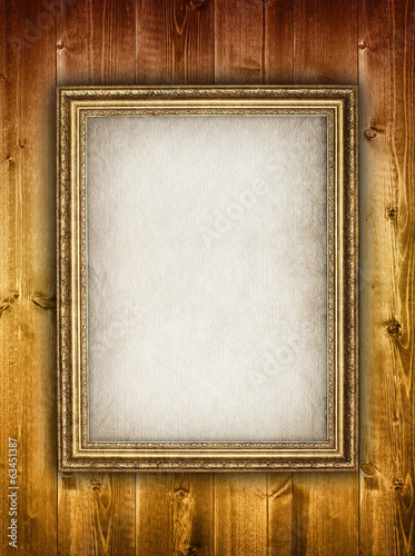 Picture frame on wooden background