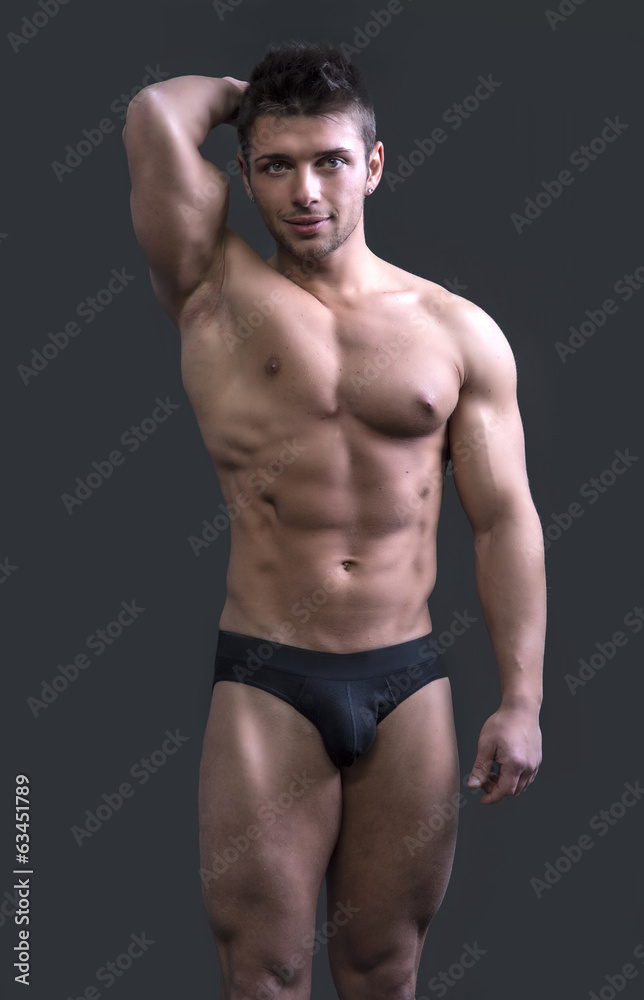 Cute muscular ripped young bodybuilder in underwear Stock Photo | Adobe  Stock