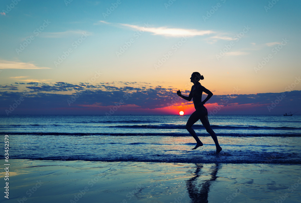 Girl runing  along the sea coast