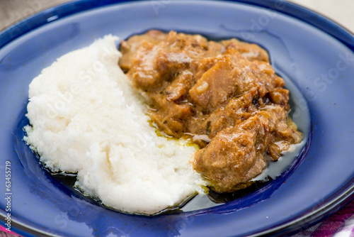 Piatto di baccalà con polenta bianca photo