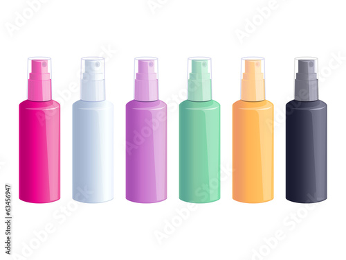 Set of colorful spray bottles on white background.