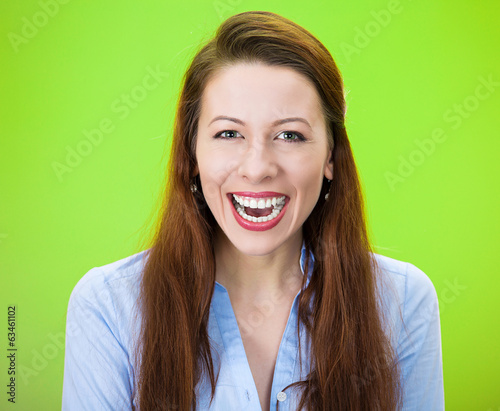 Fotografie Laughing woman isolated on green background