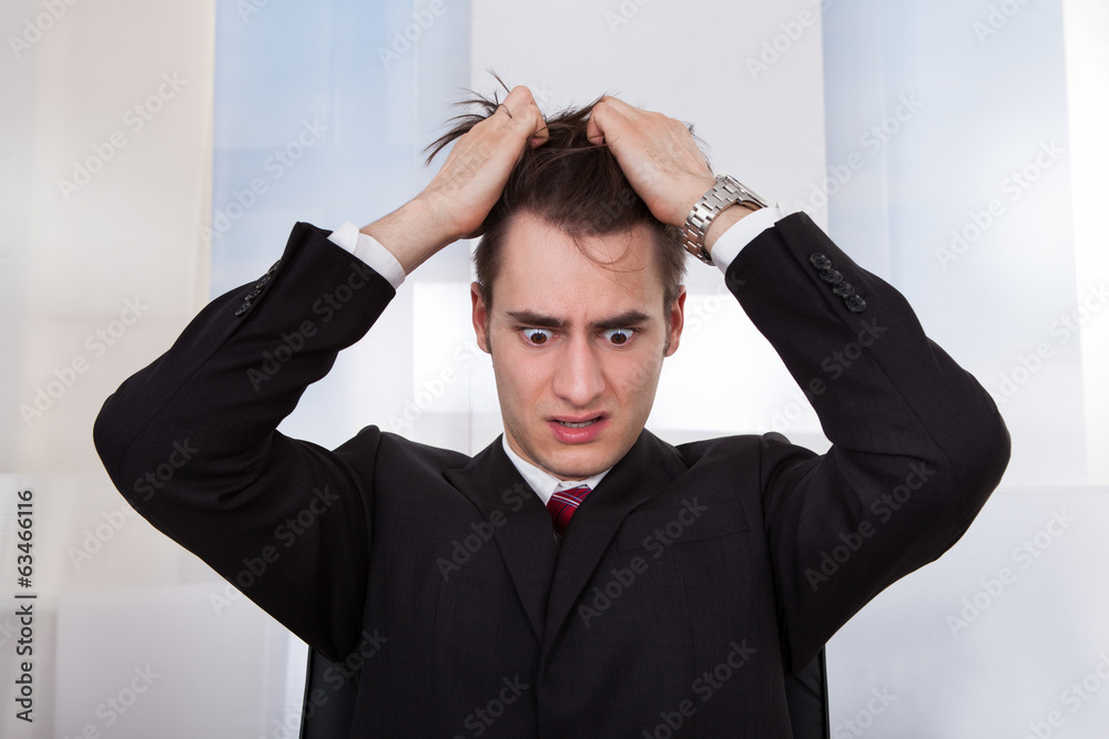 Confused Businessman Pulling Hair Confused Businessman Pulling Hair