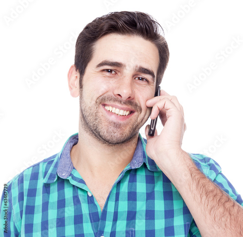 Handsome latin man talking on cell phone, isolated on a white ba