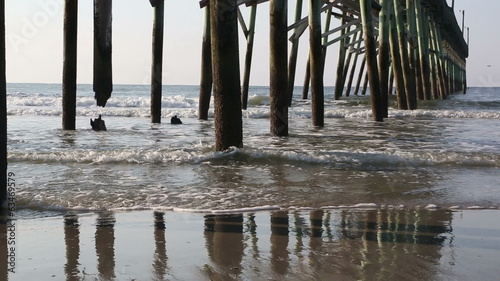 Waves under fishing pier