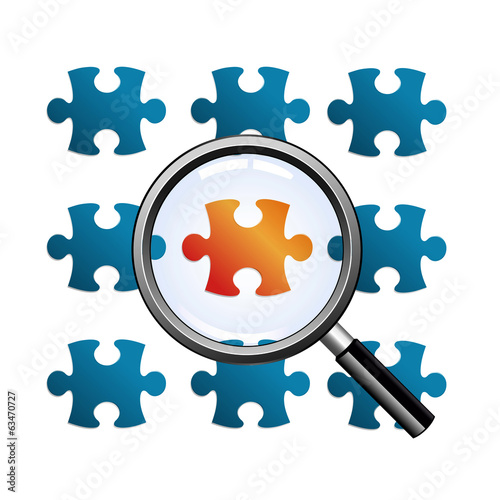 magnify glass on red puzzle