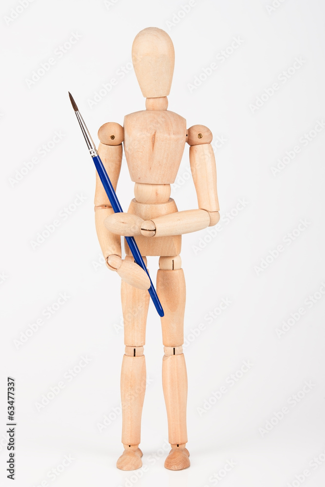 Plain wood mannequin stand upright isolated on white holding pai Plain wood mannequin stand upright isolated on white holding pai