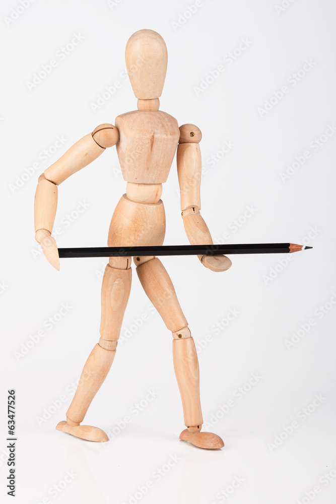 Small wood mannequin standing with colour pencil isolated on whi Small wood mannequin standing with colour pencil isolated on whi