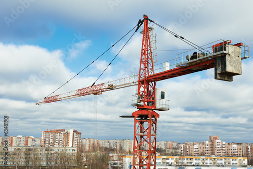 tower construction crane over city