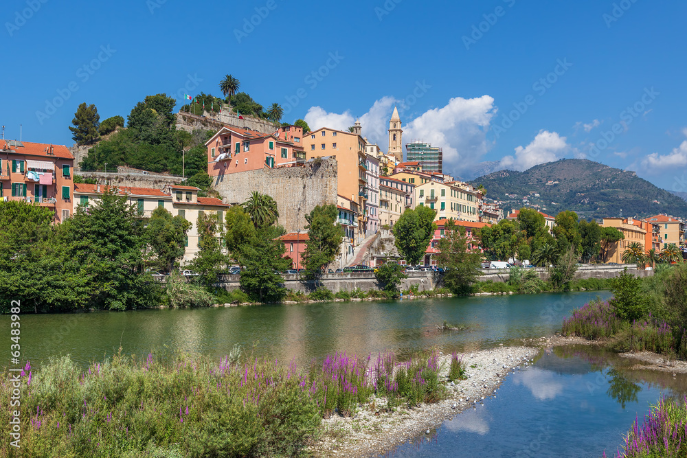Shallow stream and old town of Ventimiglia, Italy.