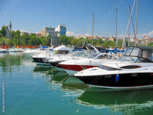 Sailboat and Yacht  anchored in the small port Tomis photo