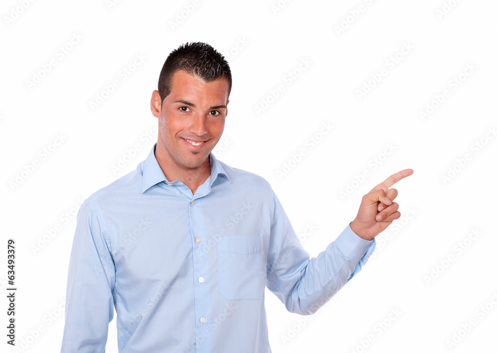 Attractive hispanic man pointing to his left Attractive hispanic man pointing to his left