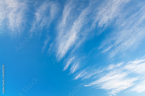 Windy clouds on the blue sky. Background photo texture