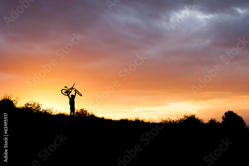 bicycle racer in the sunset