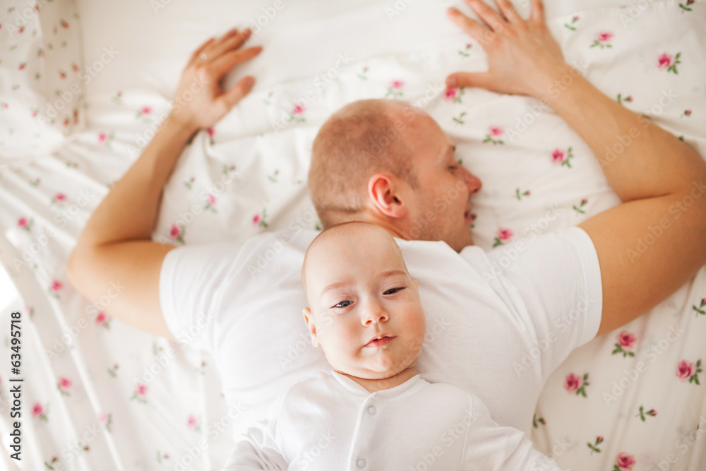Baby relaxing on his father's back Baby relaxing on his father's back