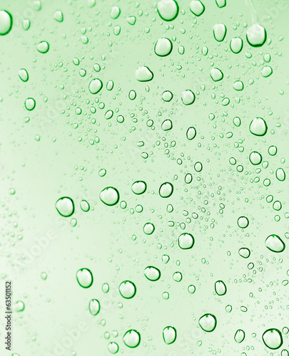 water drops on green glass. macro