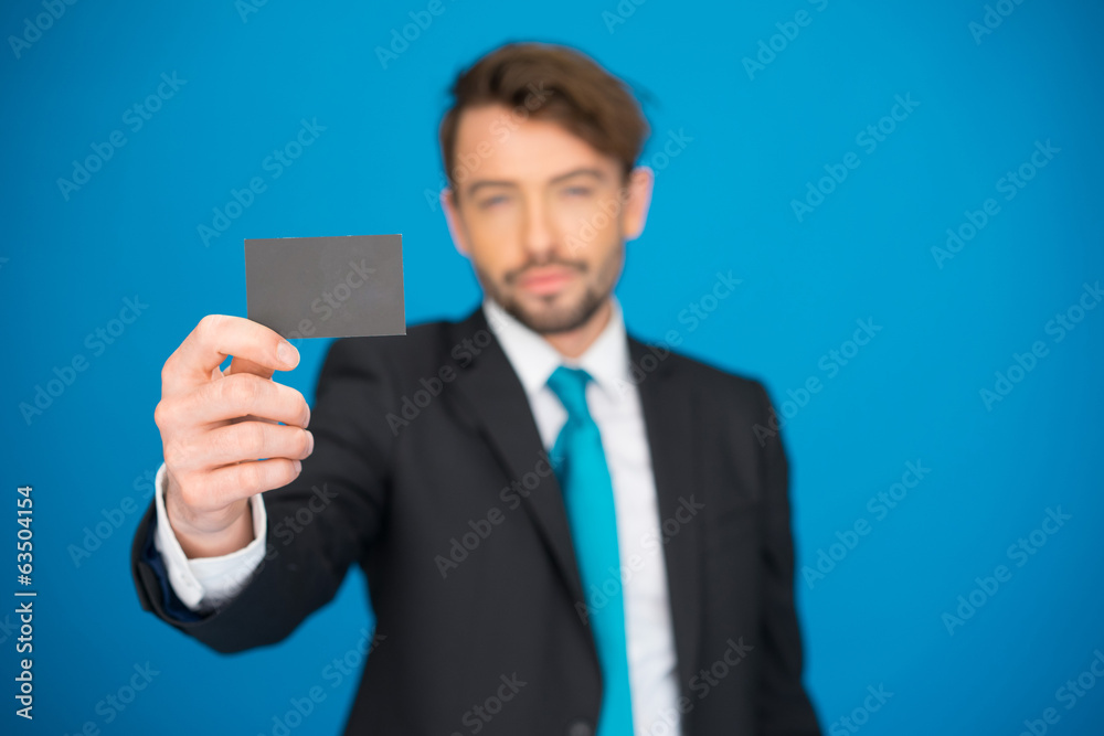 handsome businessman showing blank business card handsome businessman showing blank business card