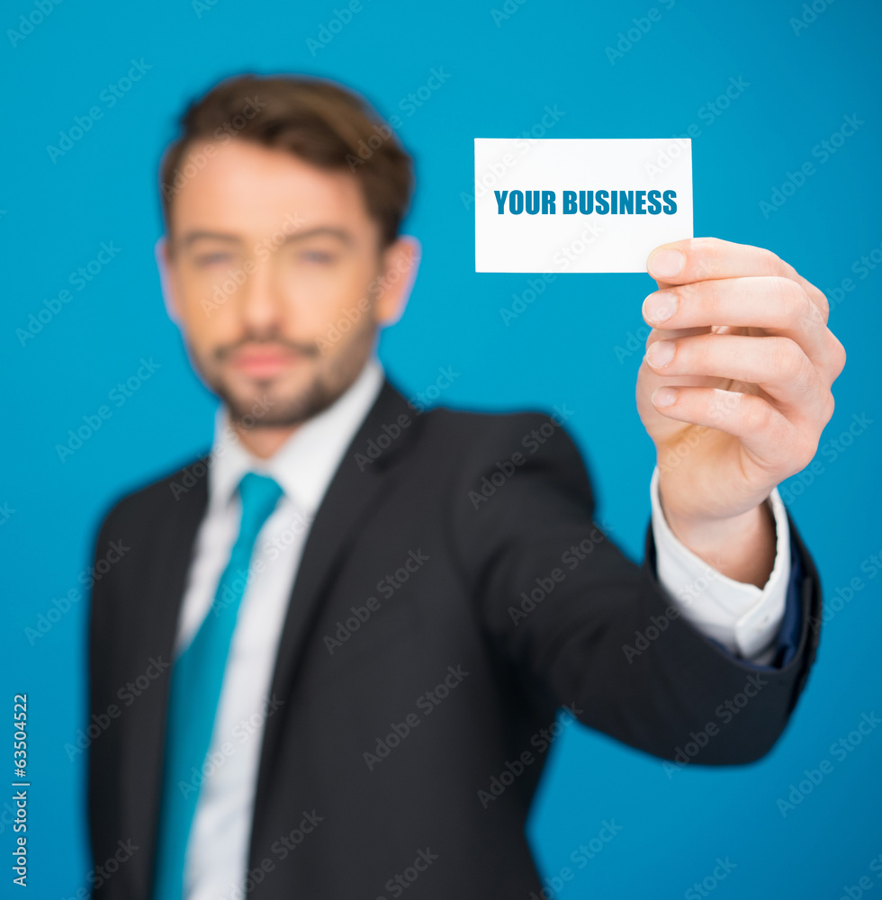 handsome businessman showing blank business card handsome businessman showing blank business card