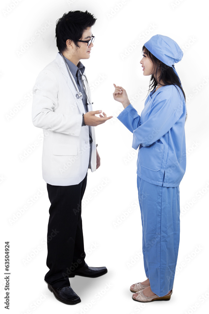 Doctors discussing while standing