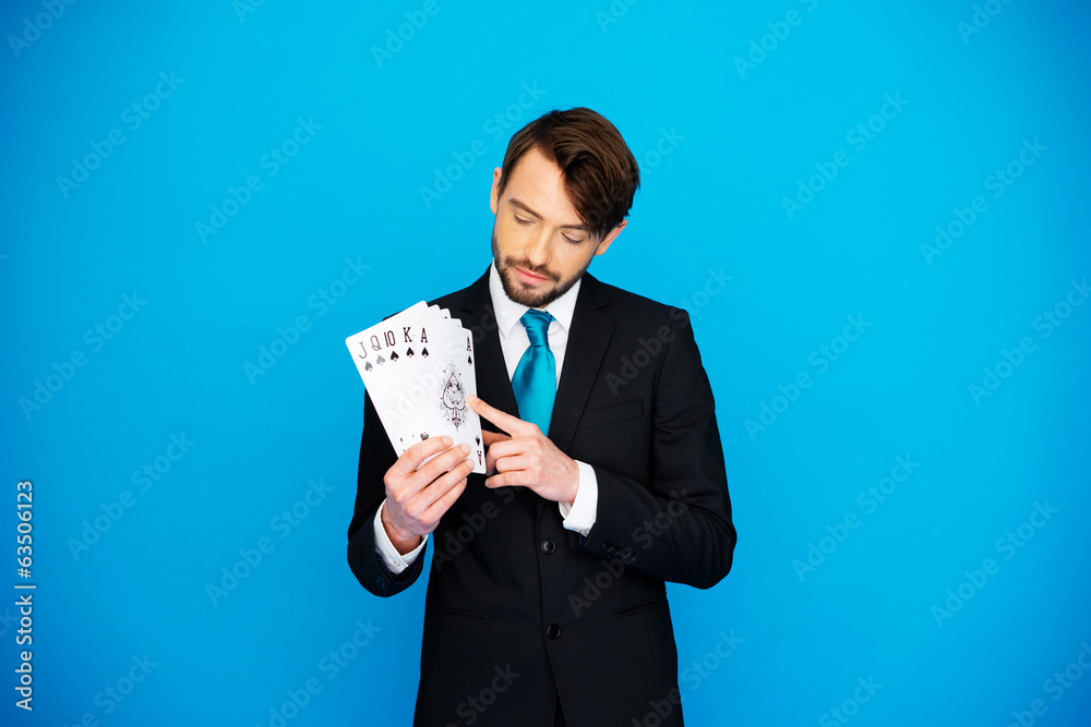 young business man showing playing cards young business man showing playing cards