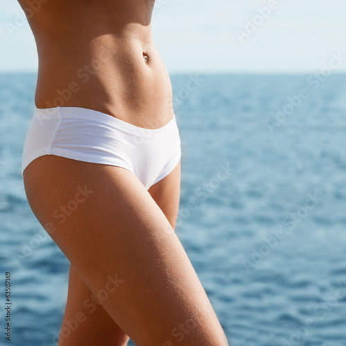 Young woman on a sea background