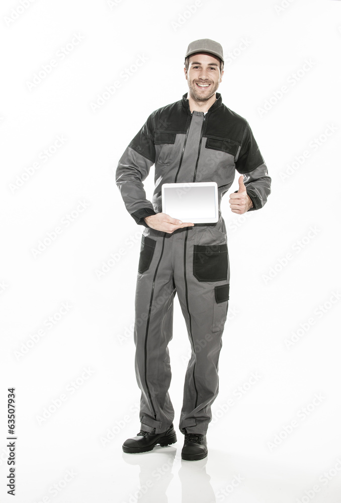 Full length portrait of a technician in a uniform showing a digi