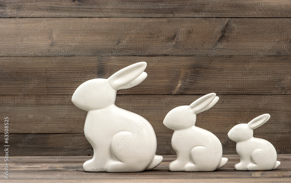Fototapeta premium cute easter bunny family on wooden background