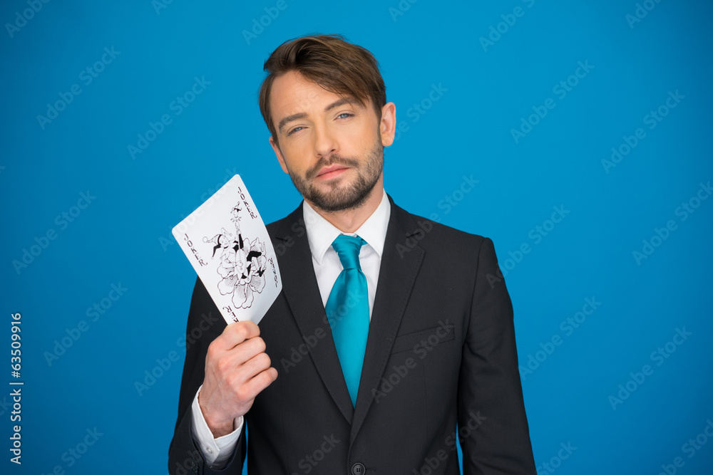 young business man showing playing cards young business man showing playing cards