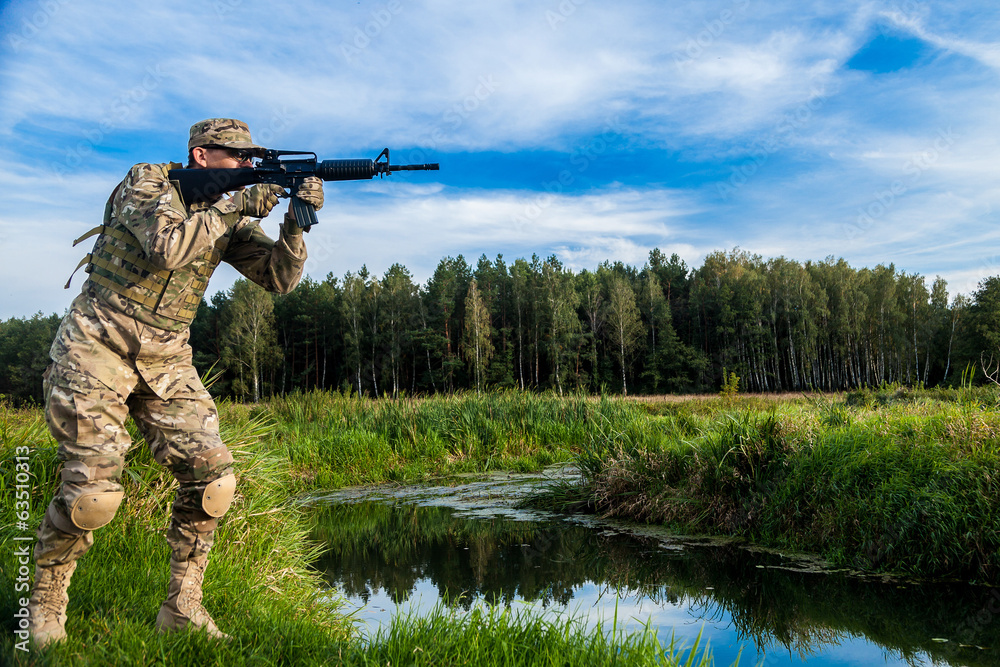 Fototapeta premium Soldier with a rifle