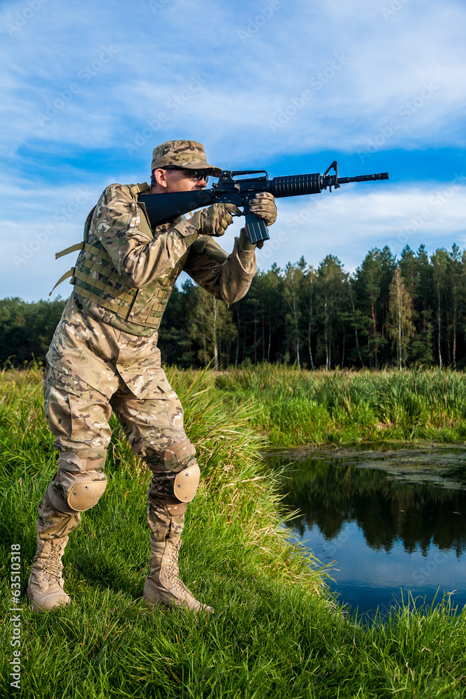Fototapeta premium Soldier with a rifle