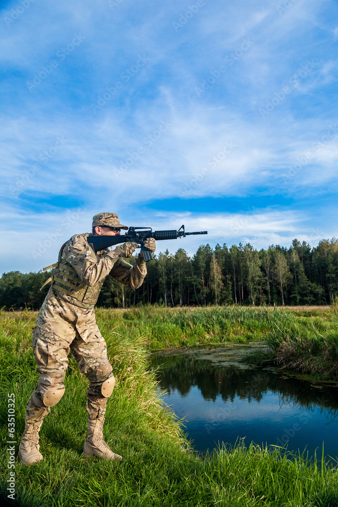 Fototapeta premium Soldier with a rifle