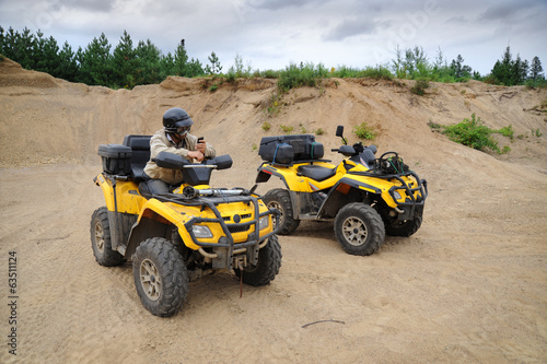 Two yellow ATV