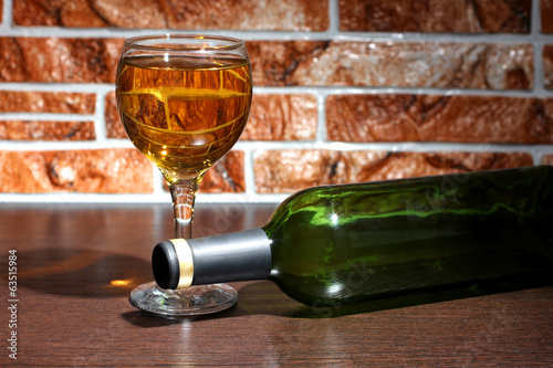 Wineglass on brick photo