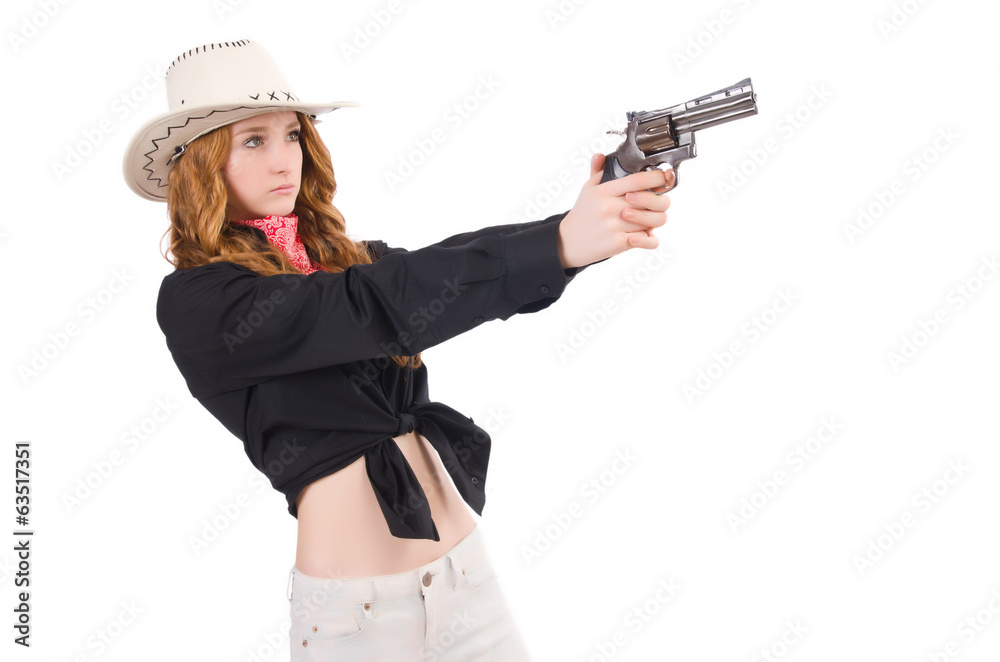 Young cowgirl with handgun isolated on white Young cowgirl with handgun isolated on white