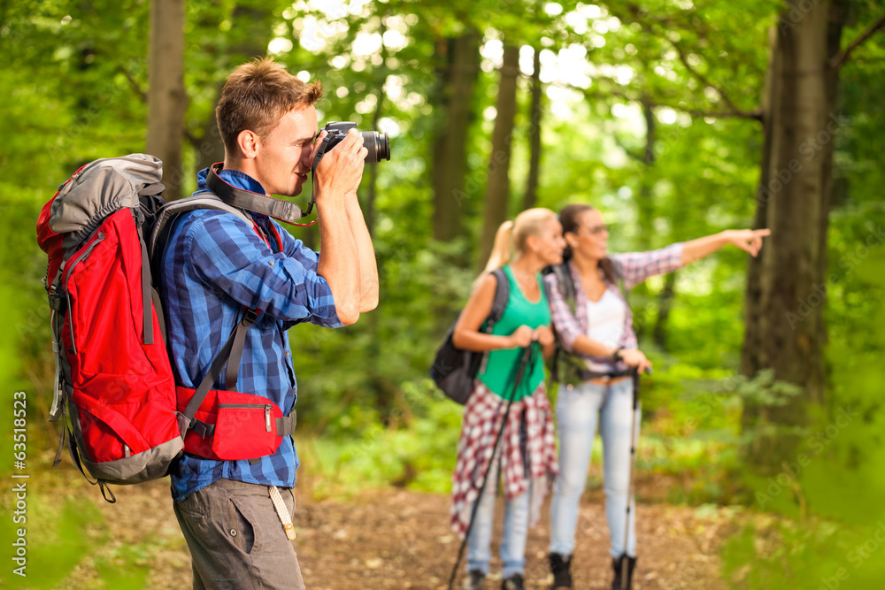 photographer taking photo during hike photographer taking photo during hike