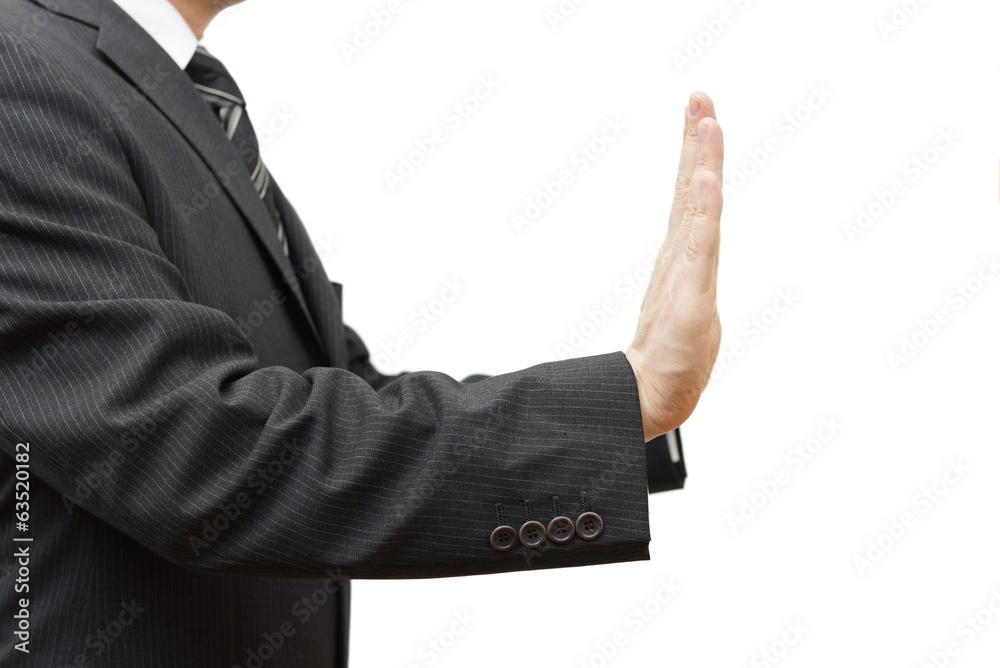 Businessman showing stop sign on white background Businessman showing stop sign on white background