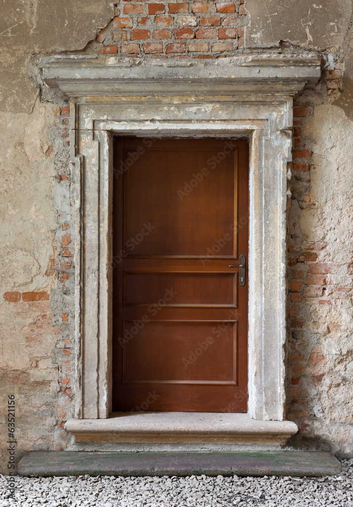 old wood made doors on abandoned background