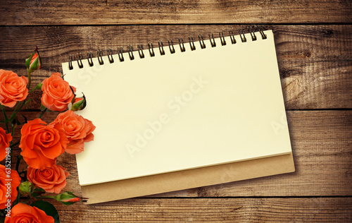 Notepad and roses photo