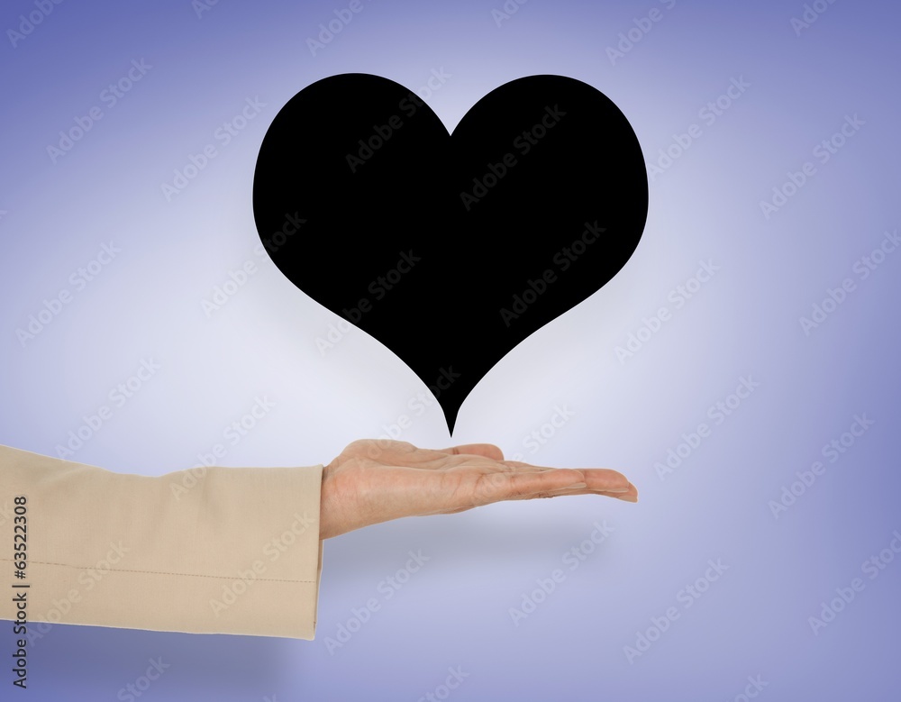 Composite image of female hand presenting heart Composite image of female hand presenting heart
