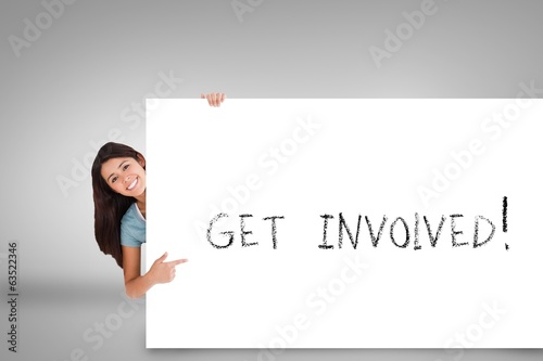 Bilde på lerret Pretty brunette showing card with get involved