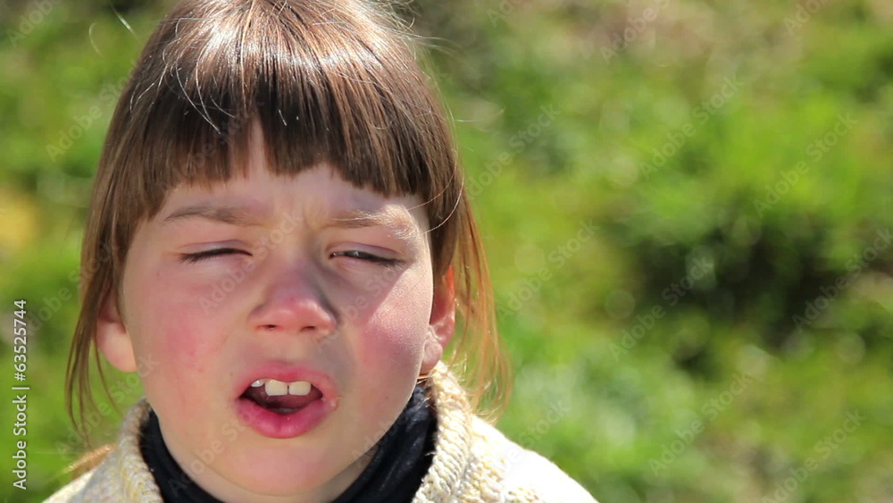 Boy shows emotion on camera,boy looks at the camera (emotion)