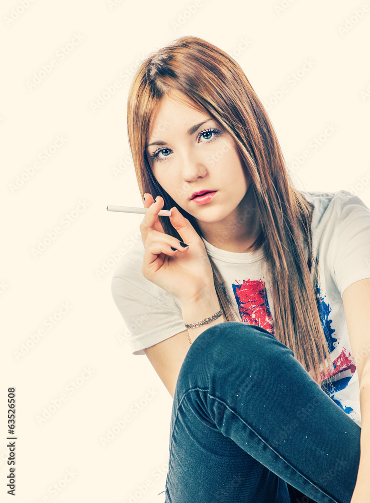 Blonde holding cigarette in her hand Blonde holding cigarette in her hand