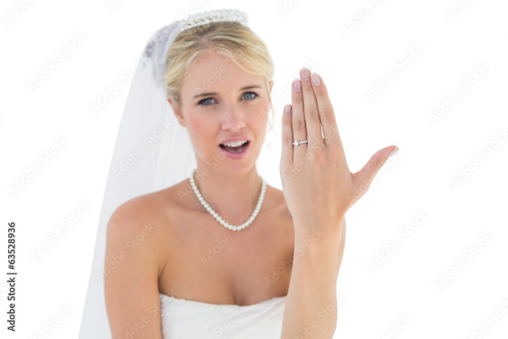 Surprised bride showing wedding ring against white background Surprised bride showing wedding ring against white background