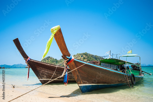 Long tailboats by the shore at Phak Bia Island, Krabi Thailand a photo