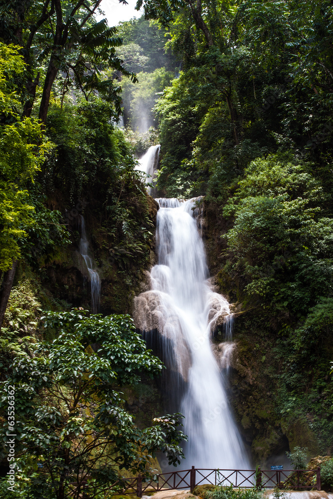 Naklejka premium LUANG PRABANG, LAOS : The Kuang Si Falls. The falls begin in sha