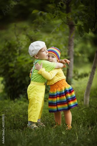 Boy with a girl in bright colored clothing